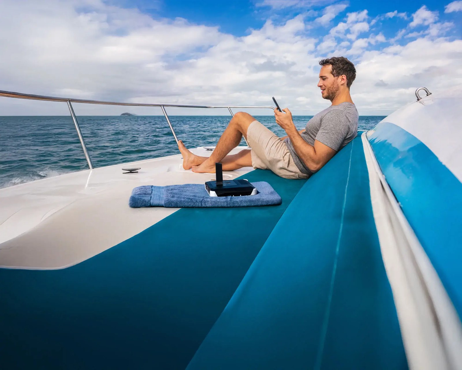 Satellite internet terminal in use on a boat deck at sea