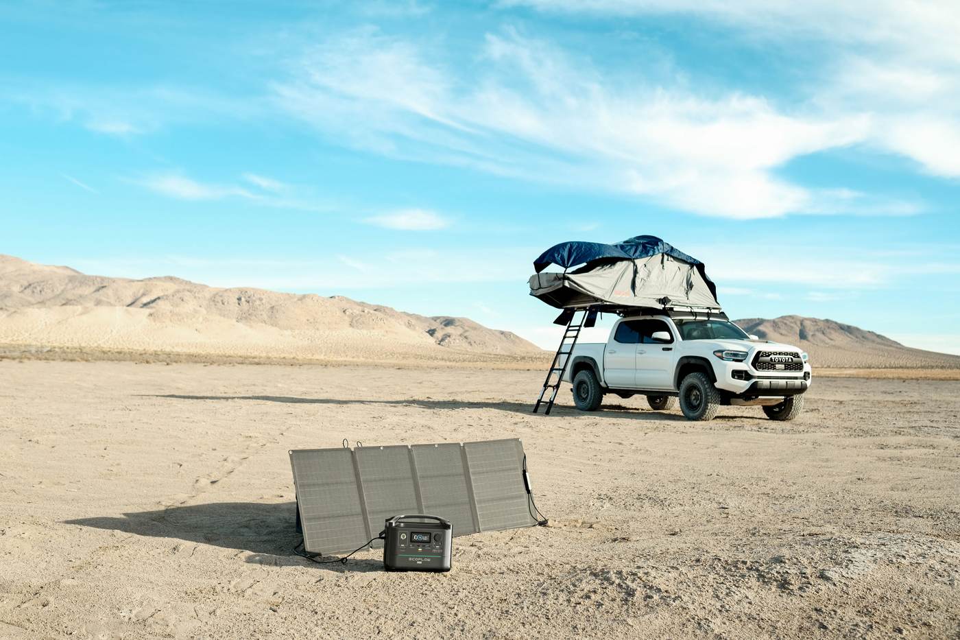 Overlanding truck with rooftop tent, EcoFlow 400W folding solar panel and DELTA power station in the desert