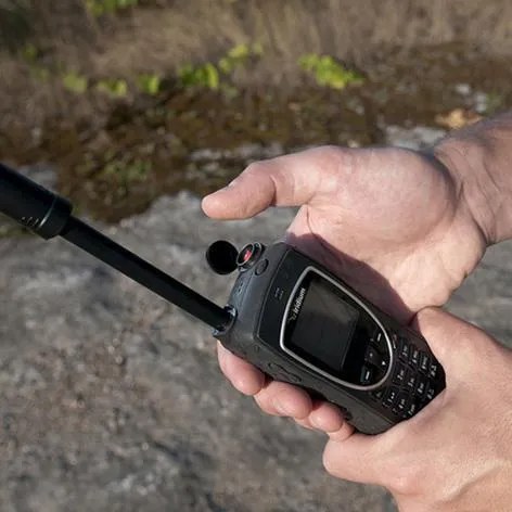 A rented Iridium 9575 Extreme satellite phone in use outdoors, away from any cell coverage