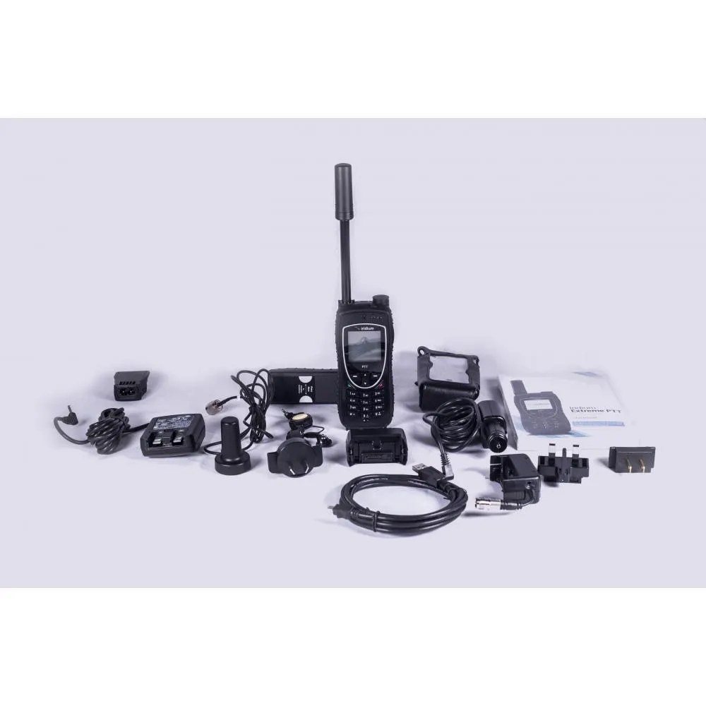 Everything in an Iridium Extreme PTT rental kit laid out: radio, chargers, adapters and cables