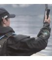 Crew member holding an Inmarsat IsatPhone 2 rental up for a clear view of the sky thumbnail